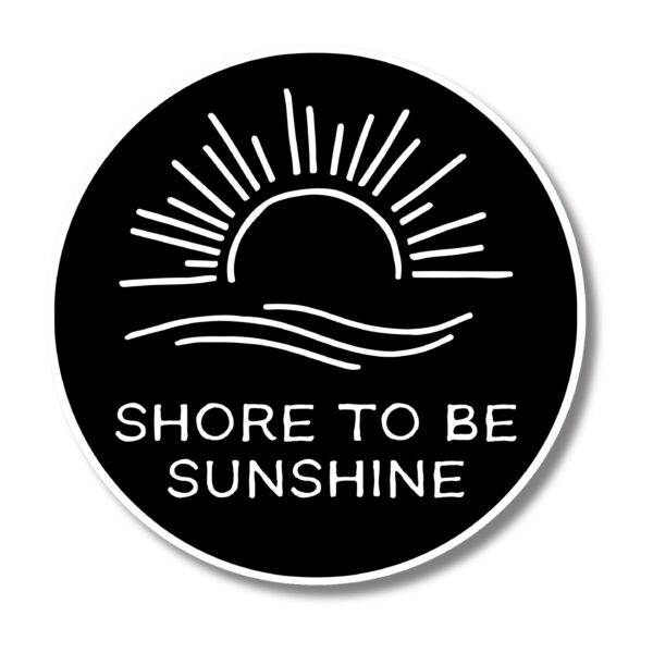 A black, circular design showcases a white illustration of a sun rising over waves, capturing the charm of the Personalized Oval Custom Beach House Signs Coastal Decor. Beneath the image, it reads SHORE TO BE SUNSHINE.