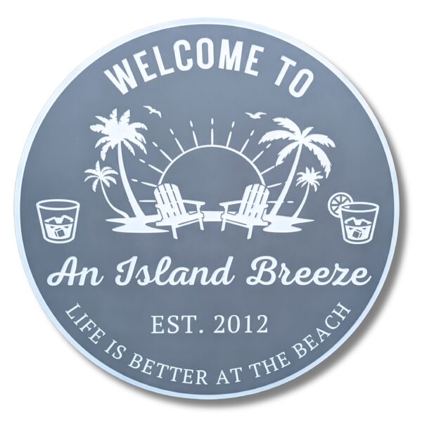 The Personalized Custom Round Beach House Sign Coastal Decor showcases two palm trees, two drinks, and two chairs facing a sun. It reads Welcome to An Island Breeze, Est. 2012 and Life is Better at the Beach.