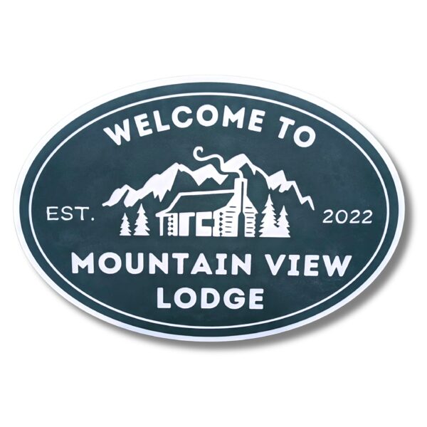 Oval sign reads Welcome to Mountain View Lodge in white, featuring a cabin with a chimney among trees and mountains, echoing the charm of Personalized Oval Custom Beach House Signs Coastal Decor. Established in 2022.