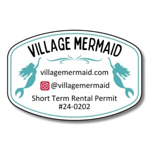 A Personalized Custom Beach House Sign reads Village Mermaid at the top, featuring two mermaid silhouettes on the sides. It includes a website, Instagram handle, and Short Term Rental Permit #24-0202, elegantly crafted in teal and black.