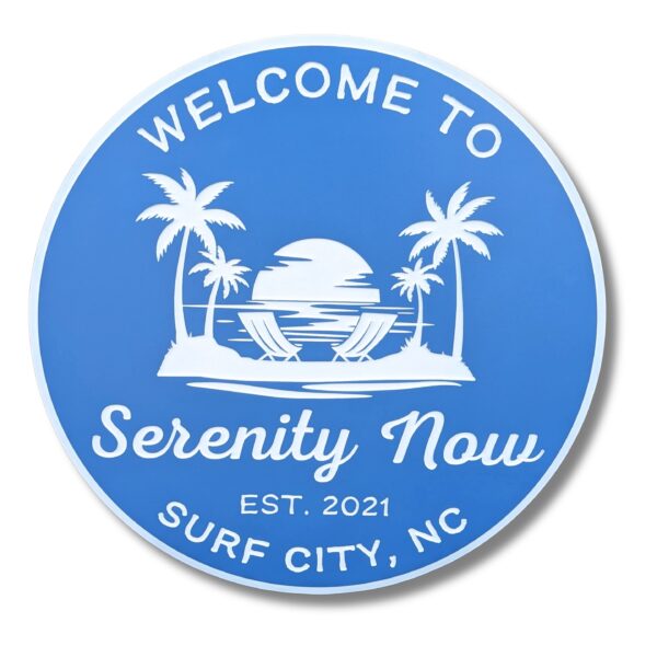 A blue and white beach house sign with palm trees and a sunset reads, Welcome to Serenity Now, Est. 2021, Surf City, NC. This personalized coastal decor piece is part of our Oval Custom Beach House Signs collection.