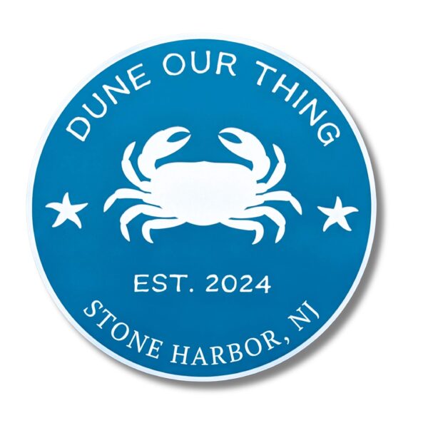 A blue circular beach house sign with a central white crab illustration is encircled by Dune Our Thing above and Stone Harbor, NJ Est. 2024 below, featuring stars on each side, in Personalized Oval Custom Beach House Signs Coastal Decor style.