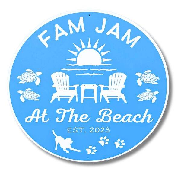 A blue circular sign with white graphics shows a sunset over waves, two chairs by a table, sea turtles, and a playful dog with paw prints. It reads Fam Jam At The Beach Est. 2023, embodying the charm of Personalized Oval Custom Beach House Signs Coastal Decor.