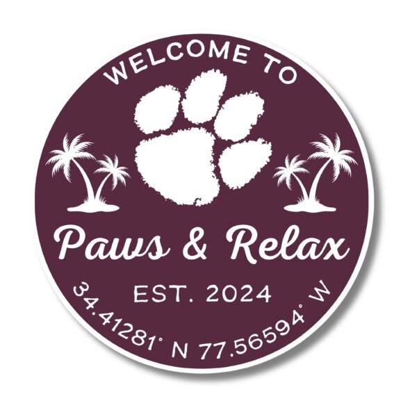 A round burgundy logo with a white paw print between two palm trees embodies the Personalized Oval Custom Beach House Signs Coastal Decor. Text says Welcome to Paws & Relax, Est. 2024 with coordinates 34.41281° N 77.56594° W below.