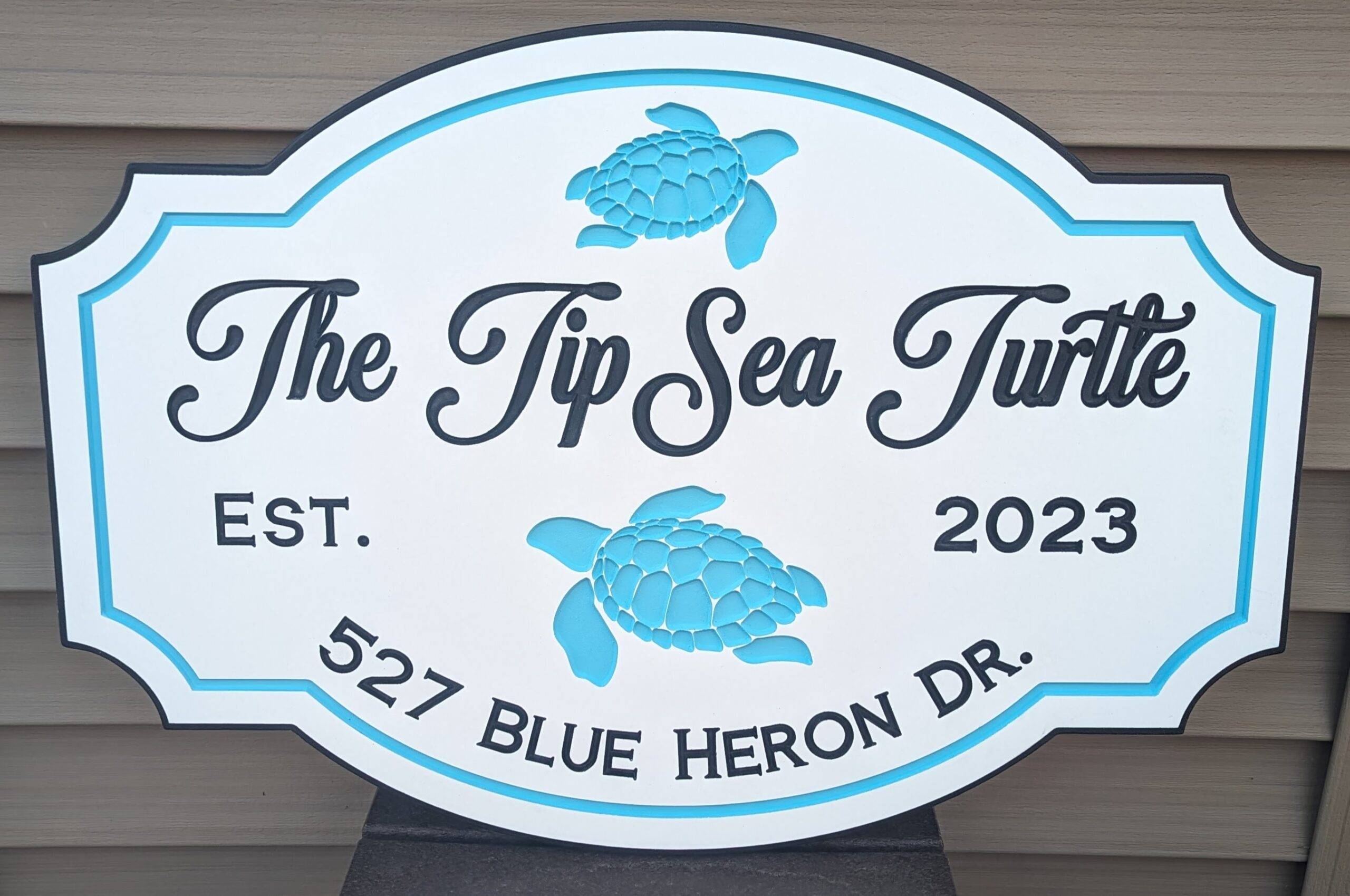 the tip sea turtle sign