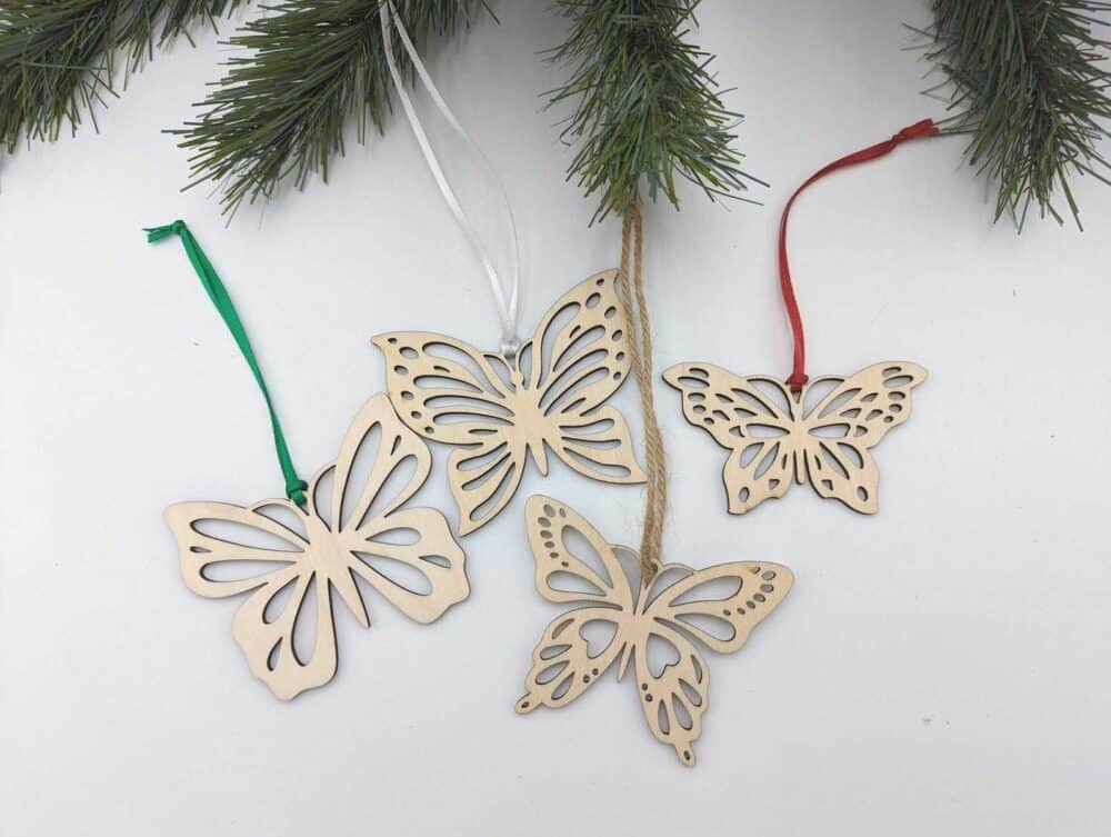 A close up of wooden ornaments hanging from a tree