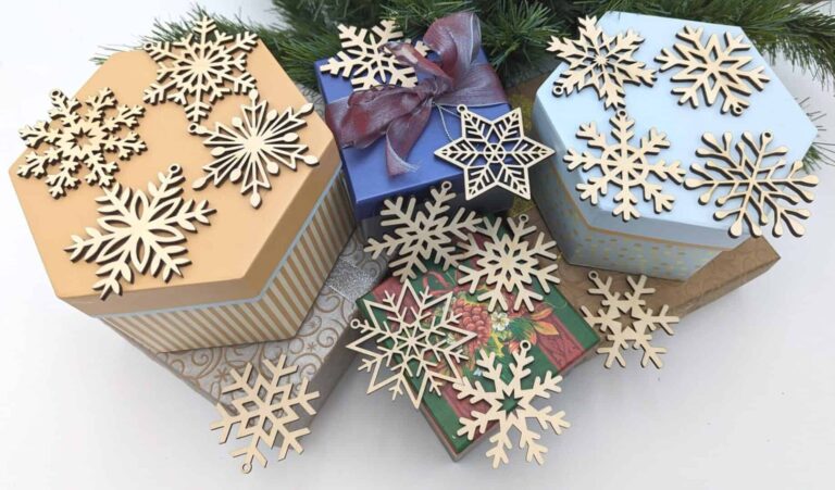 A pile of presents with wooden snowflakes on them.