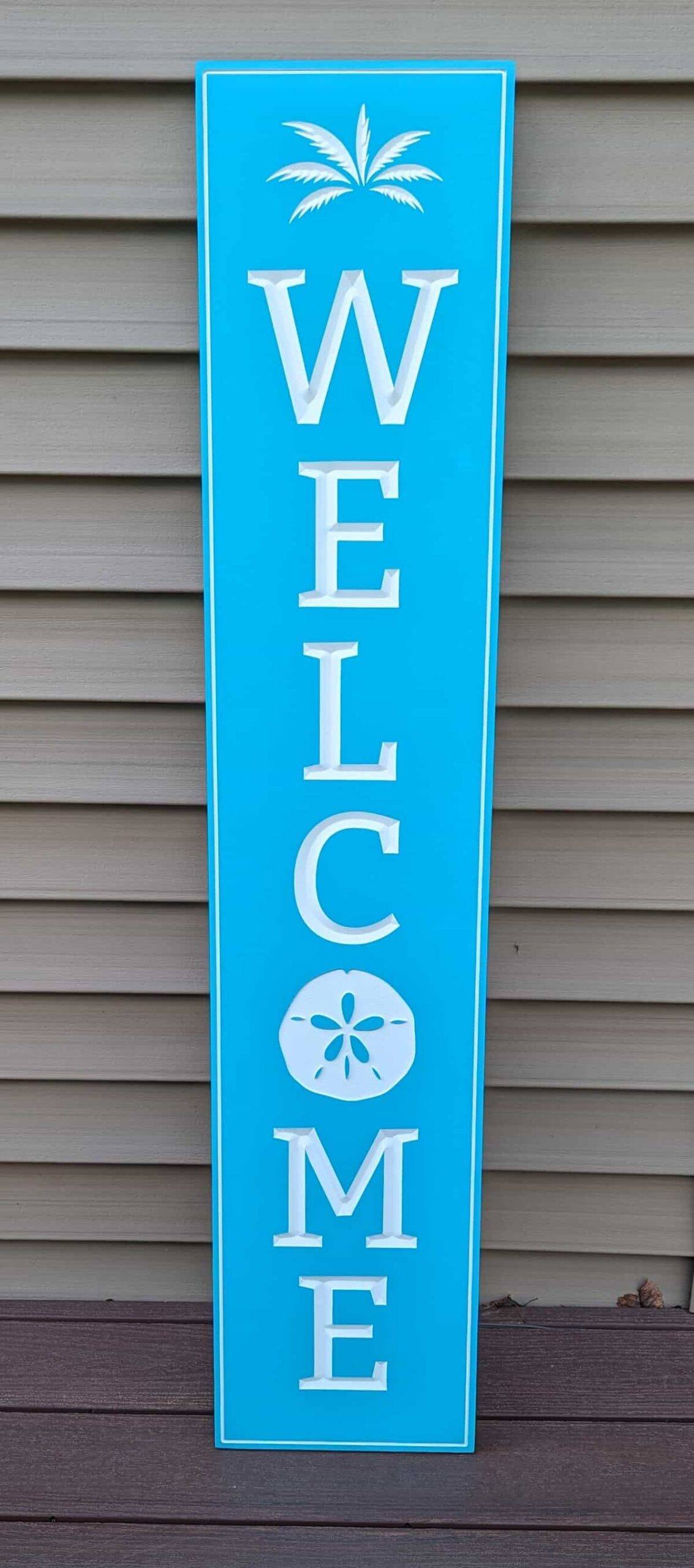 welcome sign with sand dollar blue