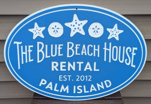 the blue beach house sign