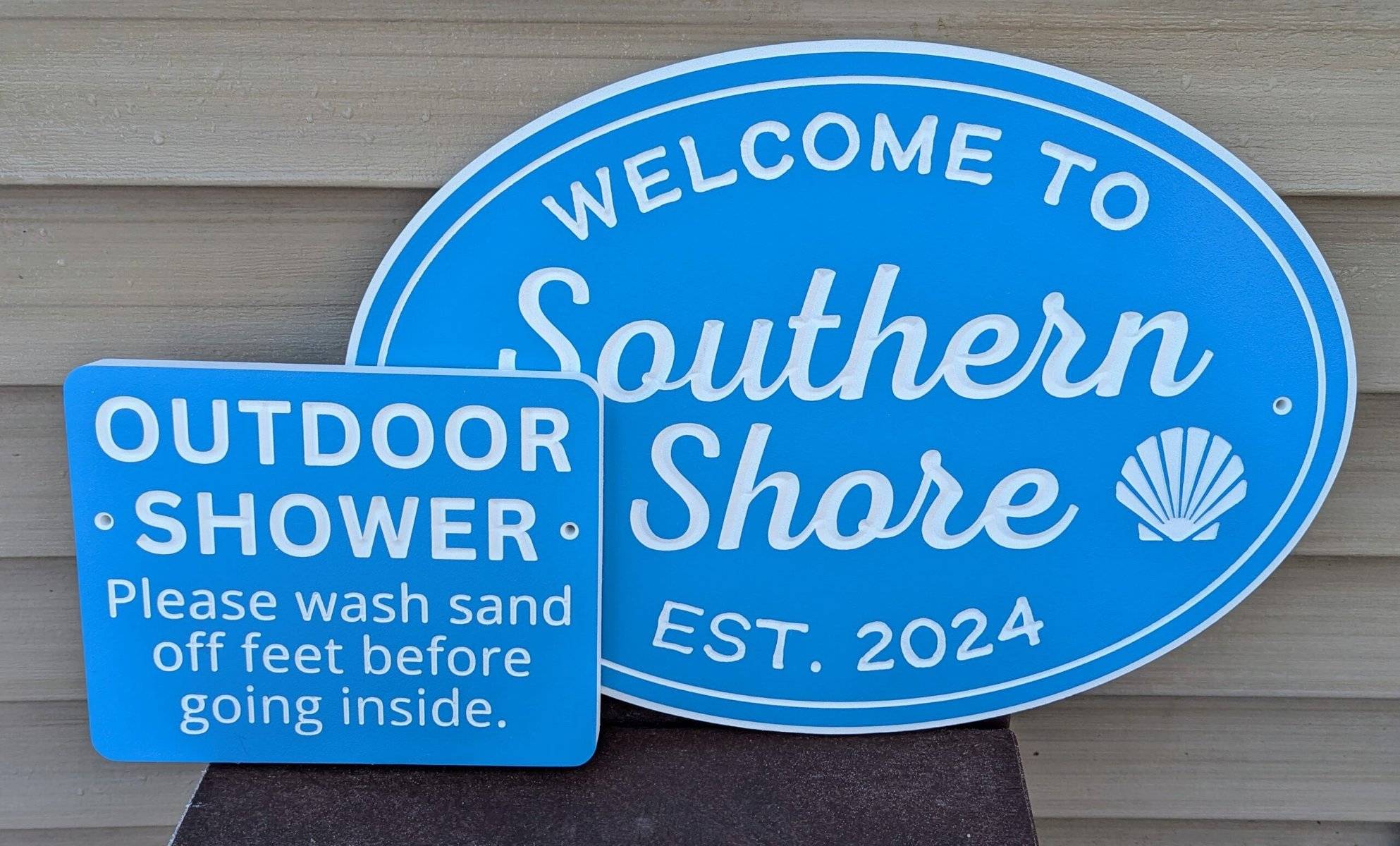 beach house and shower sign